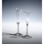 Two wine glasses or flutes c.1760, with slender drawn trumpet bowls, one with an annulated collar