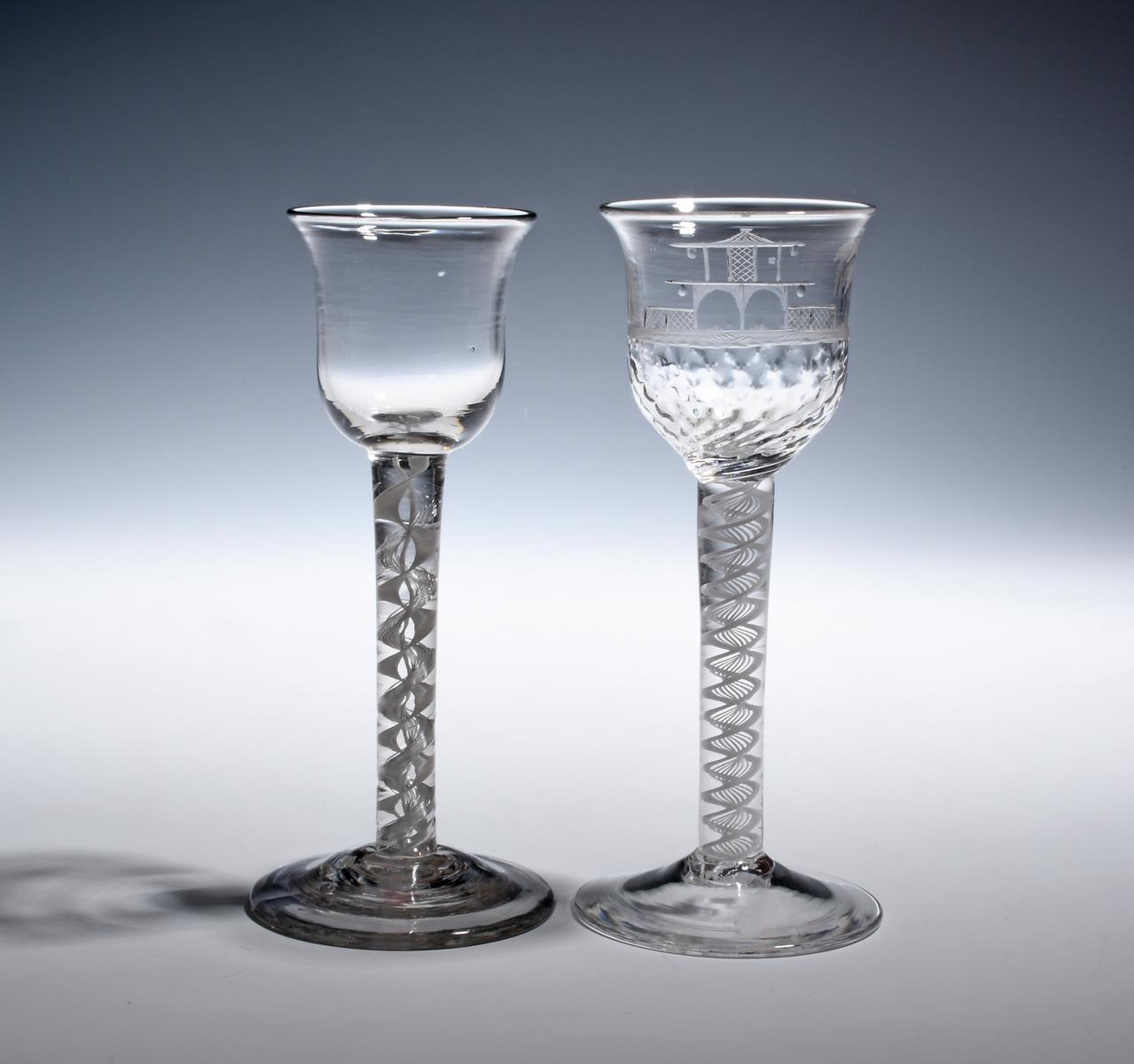 Two wine glasses c.1760, one with a moulded bell bowl engraved with chinoiserie decoration of a