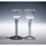 Two wine glasses c.1760, one with a moulded bell bowl engraved with chinoiserie decoration of a