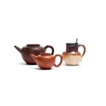 Two Dutch redware teapots 18th century, the squat bodies applied with flowerheads, the larger with