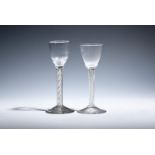 Two wine glasses c.1750-60, one with an ogee bowl raised on a double series airtwist stem, the other