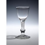 A composite stem glass goblet c.1750, the rounded bowl raised on a dense airtwist stem above an
