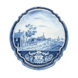 A massive pair of Delft blue and white plaques 19th century, painted in blue with farming scenes,