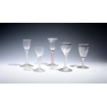 Four small English and Dutch wine glasses c.1760-70, with round funnel bowls, two engraved, raised