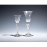 Two wine glasses c.1760, one with a large bell bowl, the other with a smaller round funnel bowl,