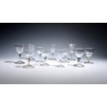 Eleven small wine or liqueur glasses late 18th and 19th centuries, three with cup bowls and plain