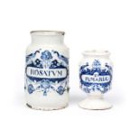 Two Delft drug jars c.1740, Low Countries, the larger inscribed 'U Rosatum', the smaller 'Et