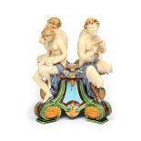 A Minton Majolica jardinière base c.1875, set with two satyrs and two nymphs holding various