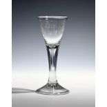 A privateer wine glass c.1780, the drawn trumpet bowl engraved 'J Barton / Success to the Unity',