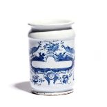 A Delft dry drug jar 2nd half 18th century, the cylindrical form painted in blue with a narrow blank