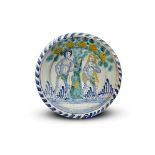 A Brislington delftware blue dash Adam and Eve charger c.1700, painted with a scene of the