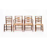 A set of two oak armchairs and two chairs designed by Charles Robert Ashbee, probably manufactured
