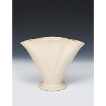 A Fulham Pottery Coralie flower vase designed by Gerard De Witt, footed, flaring form, glazed to the