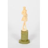 λ Ferdinand Preiss, attributed Lady standing on tiptoes, carved ivory figure on faceted green onyx