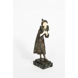 λ Luce Pierrette patinated bronze and ivory of a pierrette standing,on green veined marble base