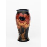 'Big Poppy' a Moorcroft Pottery vase designed by William Moorcroft, slender baluster form with