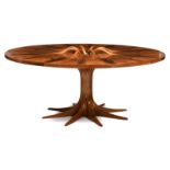 ‡A large American walnut circular table by Robin Williams, the top with sixteen figured walnut