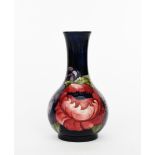 'Big Poppy' a Moorcroft Pottery bottle vase designed by William Moorcroft, ovoid with cylindrical