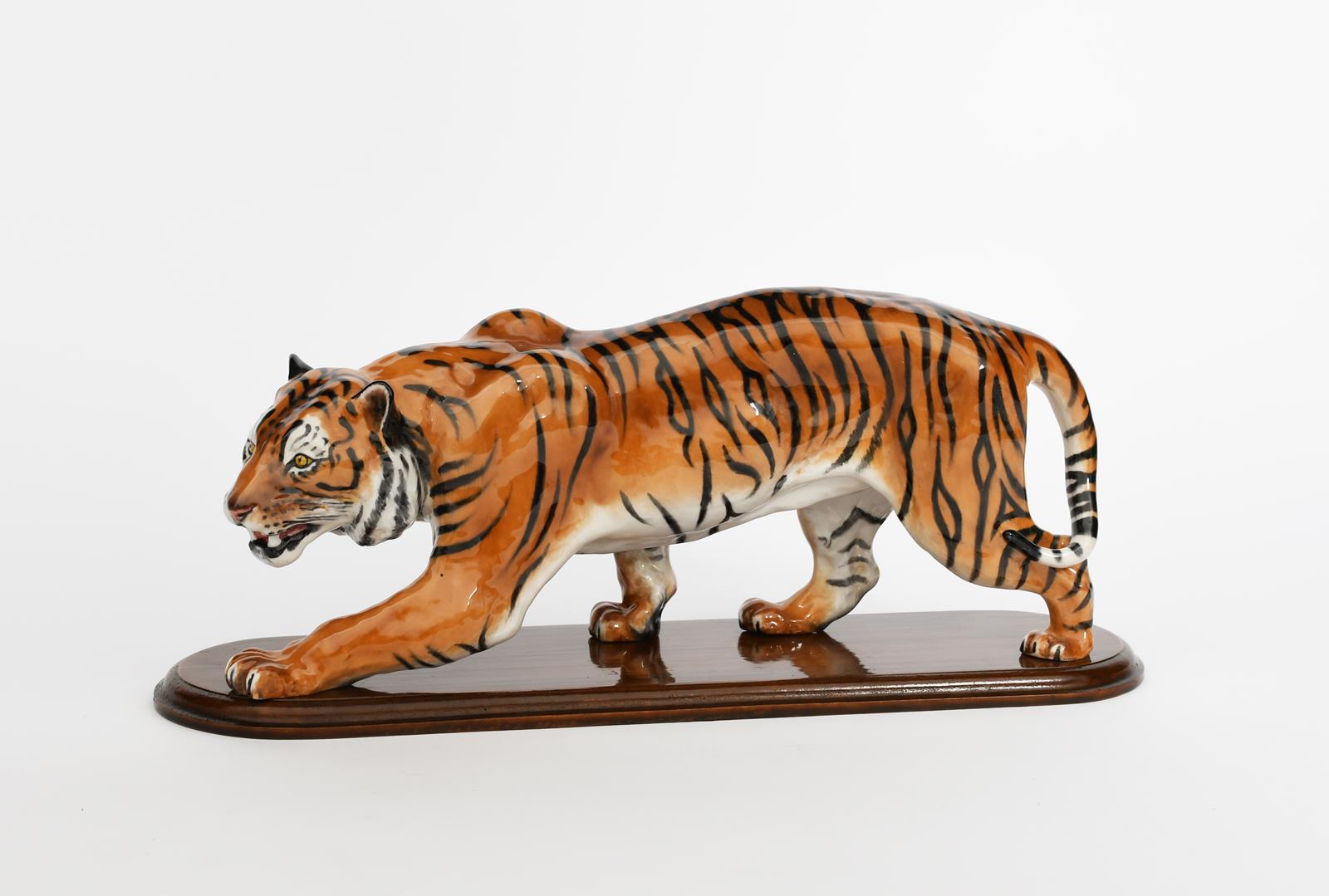 'Stalking Tiger' HN2646 a Royal Doulton figure, painted in colours, with wooden stand, printed and