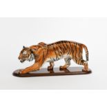 'Stalking Tiger' HN2646 a Royal Doulton figure, painted in colours, with wooden stand, printed and