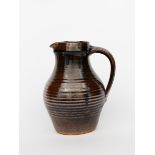 ‡David Leach OBE (1911-2005) a Lowerdown Pottery stoneware jug, covered in a tenmoku glaze,