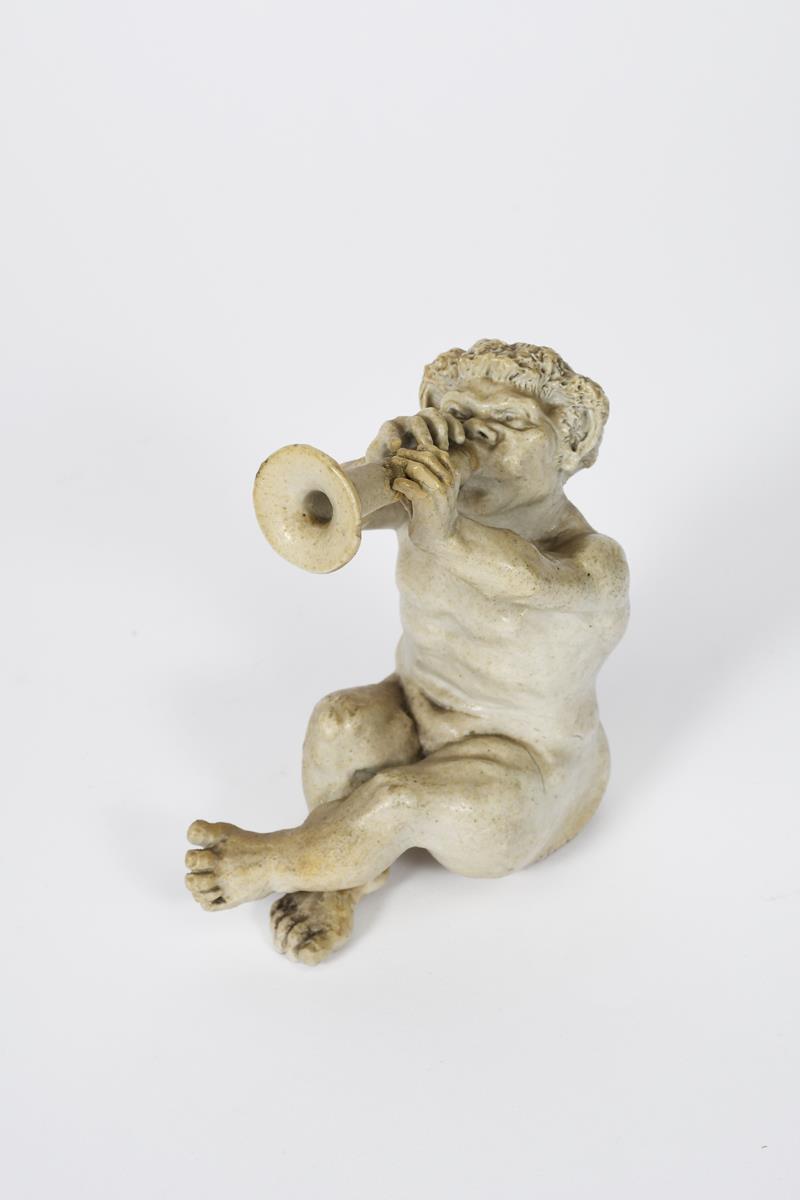 A Martin Brothers stoneware Imp Musician by Robert Wallace Martin, dated 1906, modelled seated,