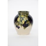 'Pansy' a Moorcroft Pottery vase designed by William Moorcroft, ovoid form with everted top rim,