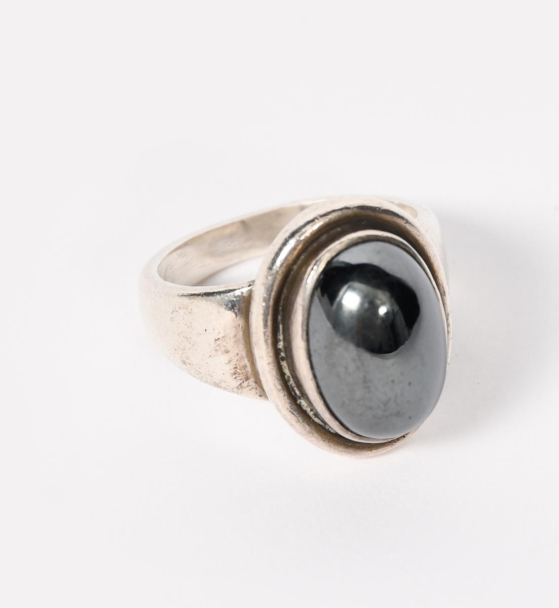 A Georg Jensen silver and hematite ring, model no.46B, set with hematite cabochon, stamped marks,