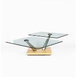 A Naos Coffee Break table designed by Gamba Guerra, two square glass tops on flaring polished