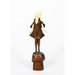 λ Professor Otto Poertzel (1876-1963) Champagne Girl, patinated bronze and ivory figure of a girl