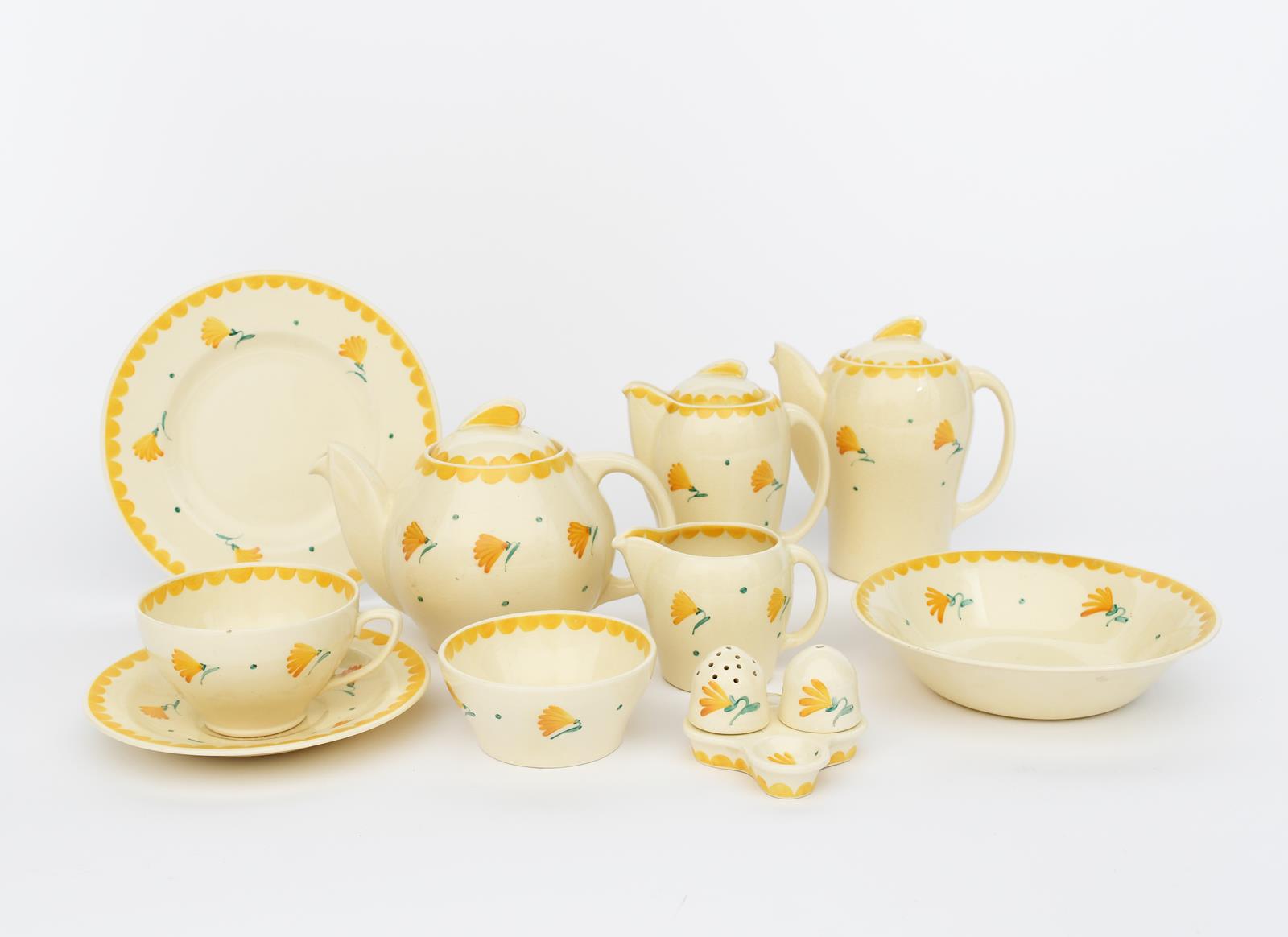 A Susie Cooper Productions Kestrel breakfast set, painted with simple yellow flower stems,