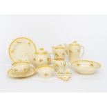 A Susie Cooper Productions Kestrel breakfast set, painted with simple yellow flower stems,