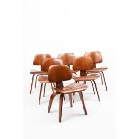 A set of six Herman Miller LCW chairs designed by Charles Eames, bent plywood, applied manufacturers