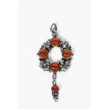 A Henry George Murphy Arts and Crafts silver and Carnelian stone pendant necklace, circular laurel