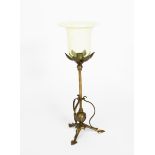 A brass and vaseline glass table lamp in the manner of WAS Benson, tripod foot with heart-shaped