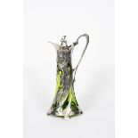A large Art Nouveau WMF Warszawa pewter and glass claret jug, the waisted and pierced cylindrical