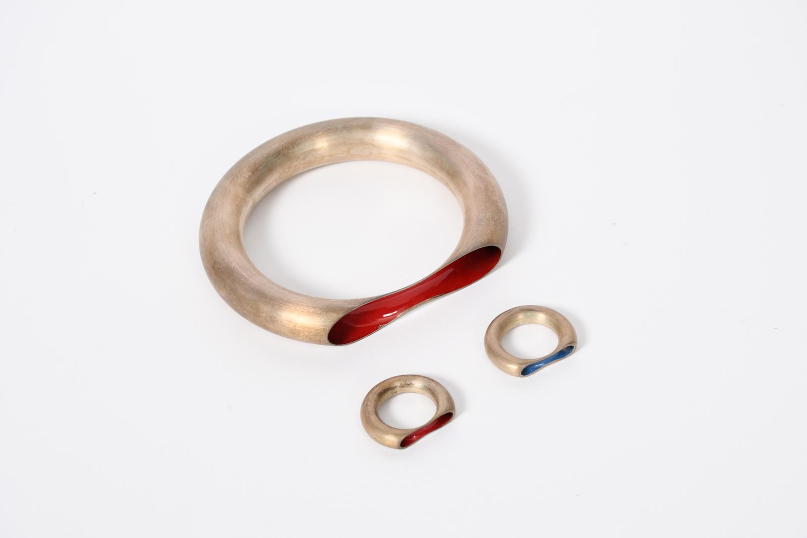 Marc Newson (born 1963) Orgone, a silver bracelet and two rings by chi ha paura, the bracelet and