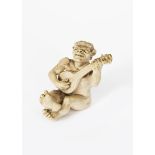 A Martin Brothers stoneware Imp Musician by Robert Wallace Martin, dated 1910, modelled seated,