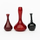 A Bernard Moore bottle vase, ovoid with tall, swollen solifleur neck, covered in a red flambe glaze,