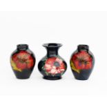 'Flambe Hibiscus' a pair of Moorcroft Pottery vases designed by Walter Moorcroft, swollen,