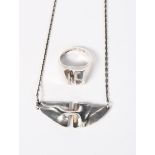 A Lapponia silver necklace designed by Bjorn Weckstrom, abstract form on link chain, and a ring