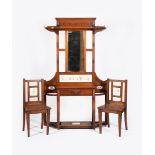 A tile mounted mahogany hall stand and en suite hall chairs, with carved decorative panels,
