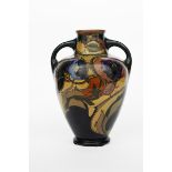 A large Gouda Pottery earthenware vase, shouldered twin-handled form, painted with Art Nouveau