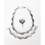 An Aarre and Krogh Danish silver necklace, fourteen leaf links, a matching bracelet and a brooch