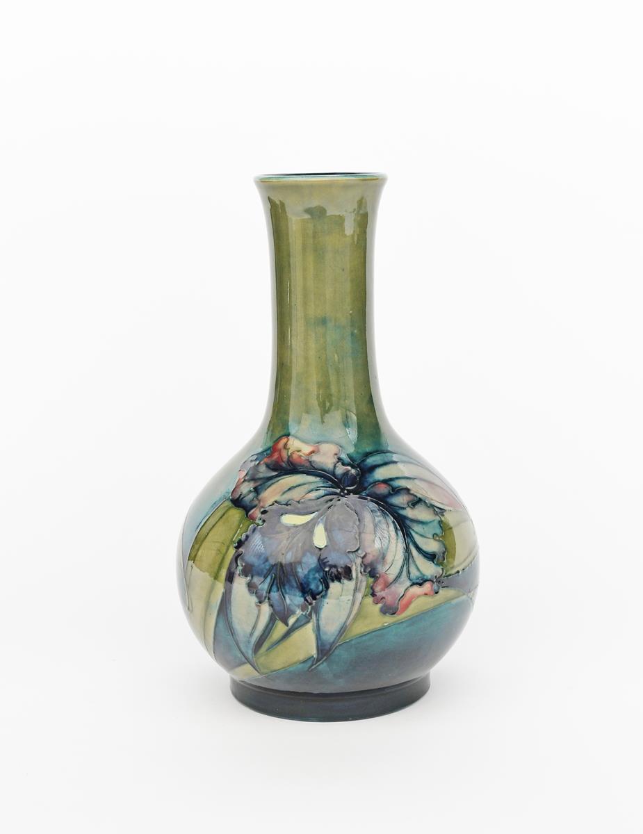 'Iris' a Moorcroft Pottery vase designed by William Moorcroft, ovoid with cylindrical neck and