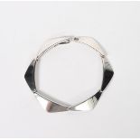 A Hans Hansen silver link bracelet, six shaped triangular panels, 17cm. wide