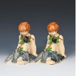 'Putti' M73 a pair of Ashtead Pottery book-ends designed by Percy Metcalfe, painted in colours