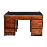 An oak partners desk the design attributed to John Pollard Seddon, rectangular top inlaid with