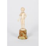 λ Ferdinand Preiss (1882-1943) Boy with a trumpet, ivory on a veined onyx base, signed F Preiss