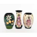 'Foxglove' a Moorcroft Pottery vase, painted in colours, another similar and a Passion flower vase